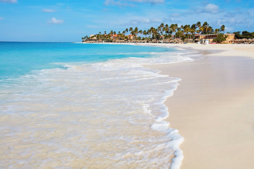 Divi Beach Aruba with a wide white shoreline and turquoise water